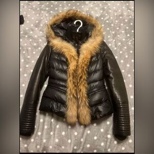 Rudsak coat. It’s used but is like brand new. The fur and leather are all real.